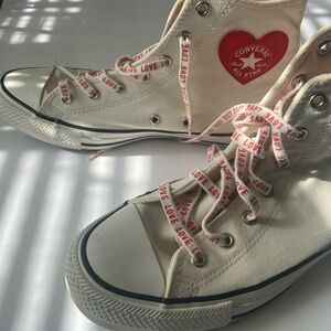 Gently used cute red and white Converse high tops.